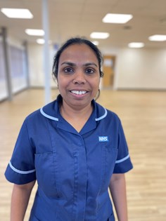 Photo of Venetia Johnson, Stroke Research Nurse wearing a mid blue tunic with light blue piping