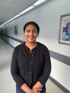 Photo of Reni Jacob in a non clinical corridor